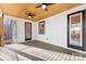 Covered porch with gray floors, modern black trim, and an exterior entrance at 40934 Deer Haven Dr, Albemarle, NC 28001