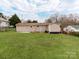 The home has a sprawling backyard lawn with partial fencing at 412 Pear St, Gastonia, NC 28054