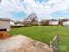 This spacious backyard has a large, grassy lawn at 412 Pear St, Gastonia, NC 28054