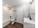 The bathroom includes a shower-tub combo and sleek black fixtures for a modern touch at 412 Pear St, Gastonia, NC 28054
