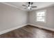Bright bedroom with window and ceiling fan is the perfect blank space to personalize at 412 Pear St, Gastonia, NC 28054