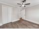 Spacious bedroom features ample closet space, a ceiling fan, and light-filled space at 412 Pear St, Gastonia, NC 28054