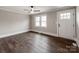 Comfortable room showcasing hardwood floors, a ceiling fan, and a door to the outside at 412 Pear St, Gastonia, NC 28054