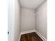 Walk-in closet features hardwood floors with neutral walls and bright white trim at 412 Pear St, Gastonia, NC 28054