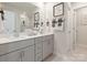 Stylish bathroom featuring a double vanity, framed mirror, and elegant decor at 459 Olympia Way, York, SC 29745