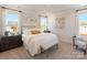 Tranquil bedroom with soft lighting, plush carpeting, stylish decor, and large windows at 459 Olympia Way, York, SC 29745