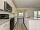 Modern kitchen featuring stainless steel appliances, granite countertops, and ample cabinet space at 459 Olympia Way, York, SC 29745