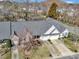 A beautiful aerial view of a single story home, with two-car garage and a meticulously kept yard at 4642 Willow Glen Rd, Harrisburg, NC 28075