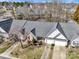 Picture of a single story house, with a two-car garage, in a neighborhood full of bare trees at 4642 Willow Glen Rd, Harrisburg, NC 28075