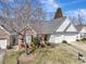 Aerial view of a lovely home with a well-manicured lawn and mature trees at 4642 Willow Glen Rd, Harrisburg, NC 28075