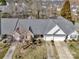An aerial view of a well maintained single story home, with a manicured lawn and two car garage at 4642 Willow Glen Rd, Harrisburg, NC 28075