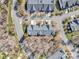 An aerial view of a neighborhood with well-maintained houses and bare trees on a sunny day at 4642 Willow Glen Rd, Harrisburg, NC 28075