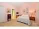 Comfortable bedroom features neutral carpet, a double bed, and coordinated furnishings at 4642 Willow Glen Rd, Harrisburg, NC 28075