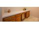 Counter area offering ample storage and a functional workspace with traditional cabinetry at 4642 Willow Glen Rd, Harrisburg, NC 28075