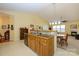 Open kitchen with cabinetry and stainless steel appliances, adjoined to a dining area at 4642 Willow Glen Rd, Harrisburg, NC 28075