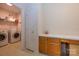 Bright laundry area features modern appliances and functional storage with a neutral decor at 4642 Willow Glen Rd, Harrisburg, NC 28075