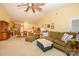 Open-concept living room showcasing vaulted ceilings, a ceiling fan, comfortable seating, and a view into the kitchen at 4642 Willow Glen Rd, Harrisburg, NC 28075