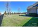 Large fenced backyard with lush grass and plenty of space for outdoor activities at 4812 Campobello Dr, Monroe, NC 28110