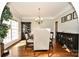 Dining room features a large window, chair railing and elegant chandelier at 4812 Campobello Dr, Monroe, NC 28110