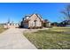 Spacious three-car garage and extra parking pad on large lot with mature trees at 4812 Campobello Dr, Monroe, NC 28110
