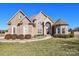 Beautiful brick and stone home with mature landscaping and arched front entry at 4812 Campobello Dr, Monroe, NC 28110