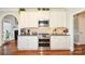 Bright kitchen featuring stainless double oven and white shaker cabinets at 4812 Campobello Dr, Monroe, NC 28110