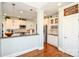 Bright kitchen with white cabinets, stainless appliances, and granite counters at 4812 Campobello Dr, Monroe, NC 28110