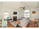 Bright living room featuring fireplace, hardwood floors, and vaulted ceiling at 4812 Campobello Dr, Monroe, NC 28110