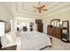 Spacious bedroom with tray ceiling, ceiling fan, and sitting area with lots of natural light at 4812 Campobello Dr, Monroe, NC 28110
