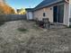 Fenced backyard with a patio, outdoor seating and fire pit create a relaxing ambiance at 5702 Burning Ridge Dr, Monroe, NC 28110