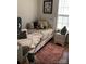 Cozy bedroom with plush carpeting, a comfortable bed, and a well-lit window at 5702 Burning Ridge Dr, Monroe, NC 28110