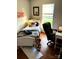 Comfortable bedroom with hardwood floors, a bright window, and a study desk at 5702 Burning Ridge Dr, Monroe, NC 28110