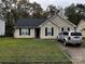 Charming home featuring a well-maintained lawn and a private driveway at 5702 Burning Ridge Dr, Monroe, NC 28110