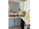 Bright kitchen with a stainless steel sink, modern cabinets, and ample counter space at 5702 Burning Ridge Dr, Monroe, NC 28110
