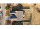 Drone shot of backyard featuring a privacy fence with mature trees beyond the perimeter at 5720 Parkstone Dr, Matthews, NC 28104