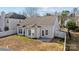 Aerial view of a house with a well maintained lawn, backyard, and new roof at 5720 Parkstone Dr, Matthews, NC 28104