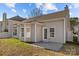 Image of the rear of a two-story home featuring a patio and views of the well maintained backyard at 5720 Parkstone Dr, Matthews, NC 28104