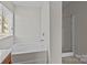 Bathroom features a soaking tub and glass enclosed shower at 5720 Parkstone Dr, Matthews, NC 28104