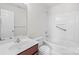 Well-lit bathroom features a vanity and a shower-tub combo at 5720 Parkstone Dr, Matthews, NC 28104