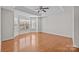Bright bedroom features a tray ceiling, ceiling fan, and natural light from the large windows at 5720 Parkstone Dr, Matthews, NC 28104