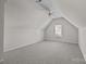 Upstairs bonus room with sloped ceilings and a ceiling fan at 5720 Parkstone Dr, Matthews, NC 28104