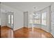 Breakfast nook with a bright bay window and hardwood floors is great for casual dining at 5720 Parkstone Dr, Matthews, NC 28104