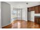 Charming breakfast nook with a bay window, hardwood floors, and a view of the backyard at 5720 Parkstone Dr, Matthews, NC 28104