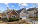 Image of the home exterior, featuring a well manicured lawn and attached two-car garage at 5720 Parkstone Dr, Matthews, NC 28104