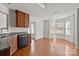 Open kitchen boasts stainless appliances, wood cabinets, and hardwood floors, perfect for casual meals at 5720 Parkstone Dr, Matthews, NC 28104