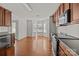 Eat-in kitchen features hardwood floors, a bay window, stainless appliances, and great natural light at 5720 Parkstone Dr, Matthews, NC 28104
