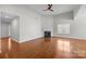 Spacious living room area with hardwood floors and a fireplace at 5720 Parkstone Dr, Matthews, NC 28104