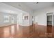 Spacious living room with hardwood floors, abundant natural light, and an open floor plan is great for entertaining at 5720 Parkstone Dr, Matthews, NC 28104
