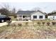Well-maintained single-story home with a welcoming front porch and driveway, set against a cloudy sky at 601 Apple St, Gastonia, NC 28054