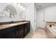 Bathroom featuring dual sinks, granite counters, and modern fixtures at 6112 Canyon Trl, Denver, NC 28037